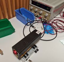 Laser connected to power supply.